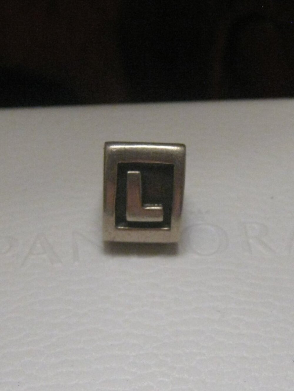 PANDORA Triangle Letter 'L' - 20$